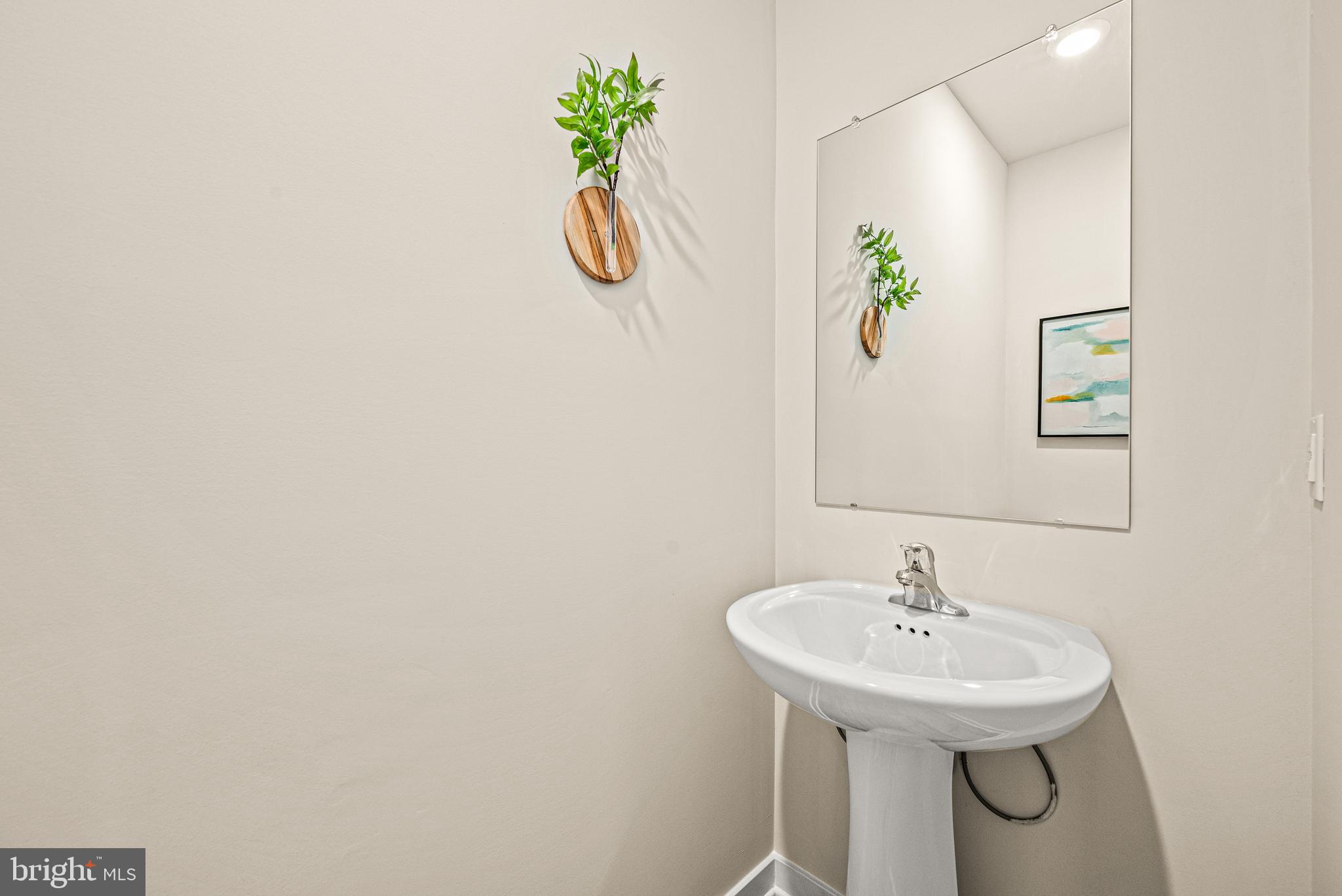 13B Ford Street, Unit A Bridgeport, PA 19405 - Photo 13 of 26 a bathroom with a sink and a mirror