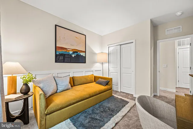 a living room with furniture and a rug