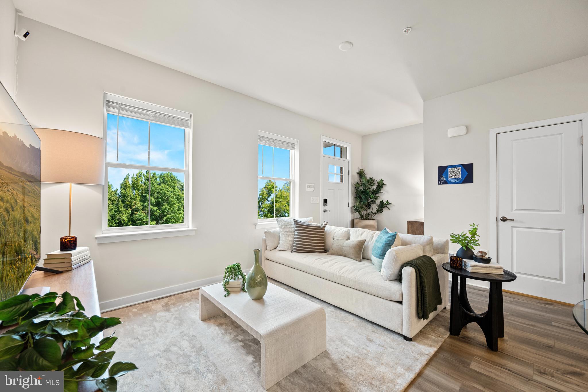 13B Ford Street, Unit A Bridgeport, PA 19405 - Photo 5 of 26 a living room with furniture plant and a window