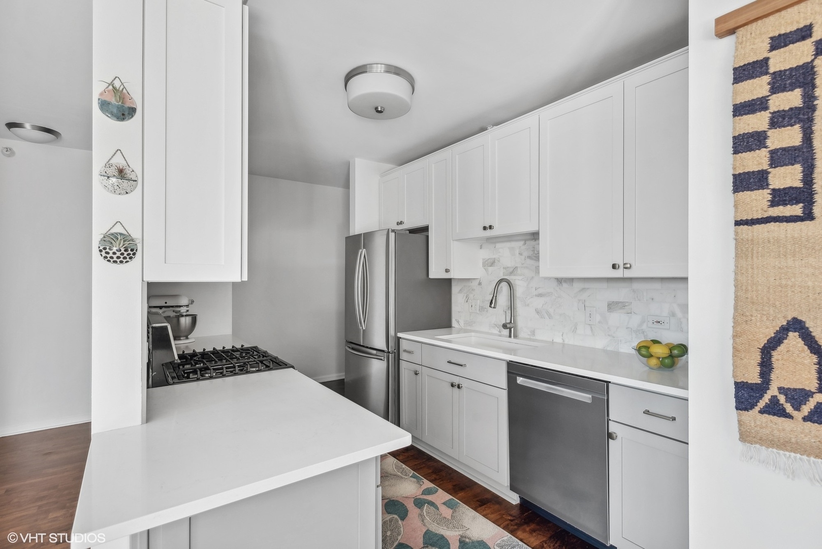630 North State Street, Unit 1108 Chicago, IL 60654 - Photo 13 of 22 a kitchen with a sink a stove and refrigerator
