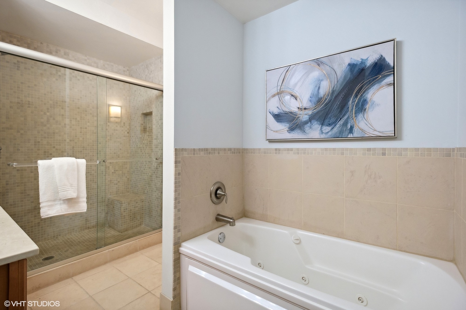 630 North State Street, Unit 1108 Chicago, IL 60654 - Photo 17 of 22 a bathroom with a bathtub and shower