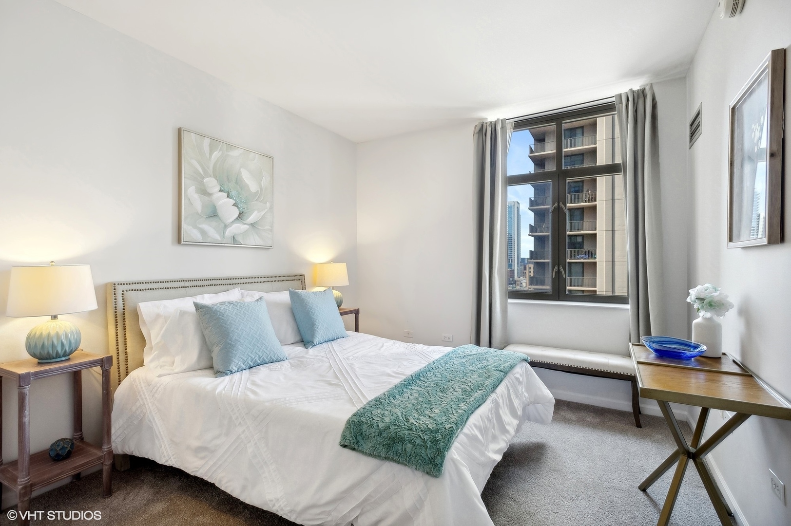 630 North State Street, Unit 1108 Chicago, IL 60654 - Photo 18 of 22 a bedroom with a bed and window