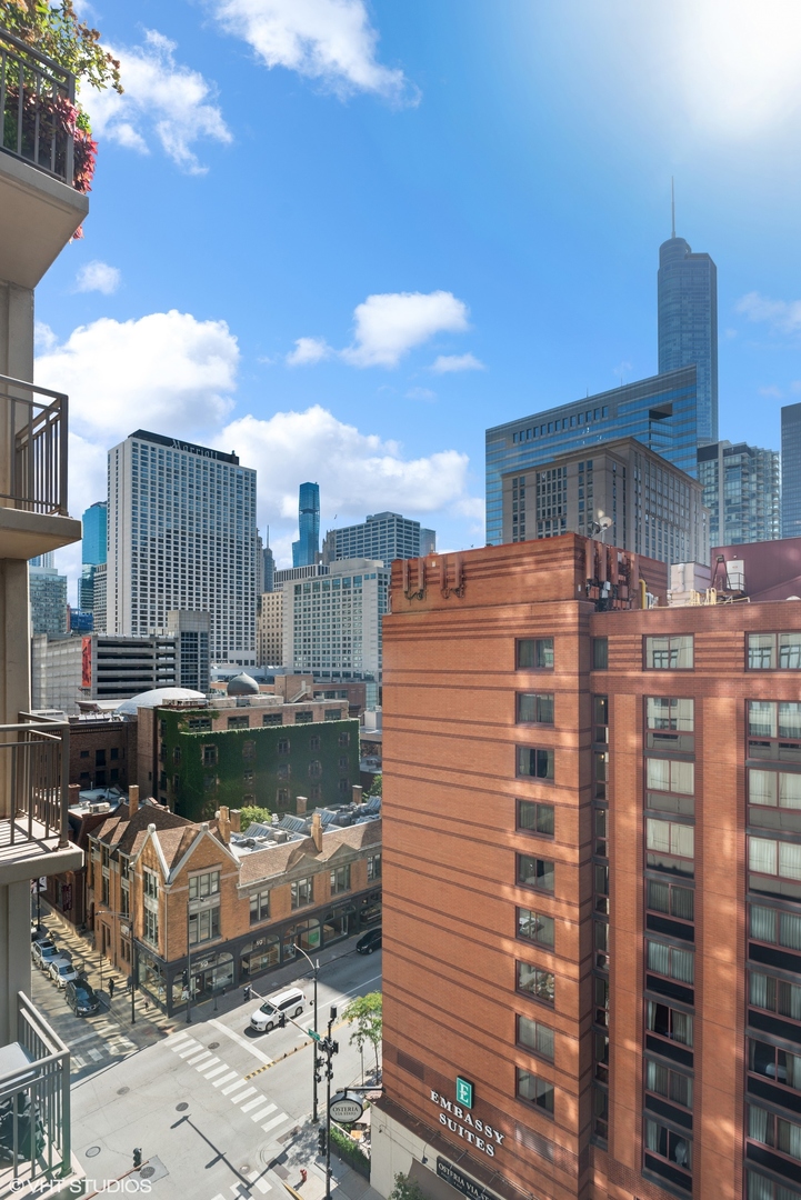 630 North State Street, Unit 1108 Chicago, IL 60654 - Photo 20 of 22 a large building with a large window and front door