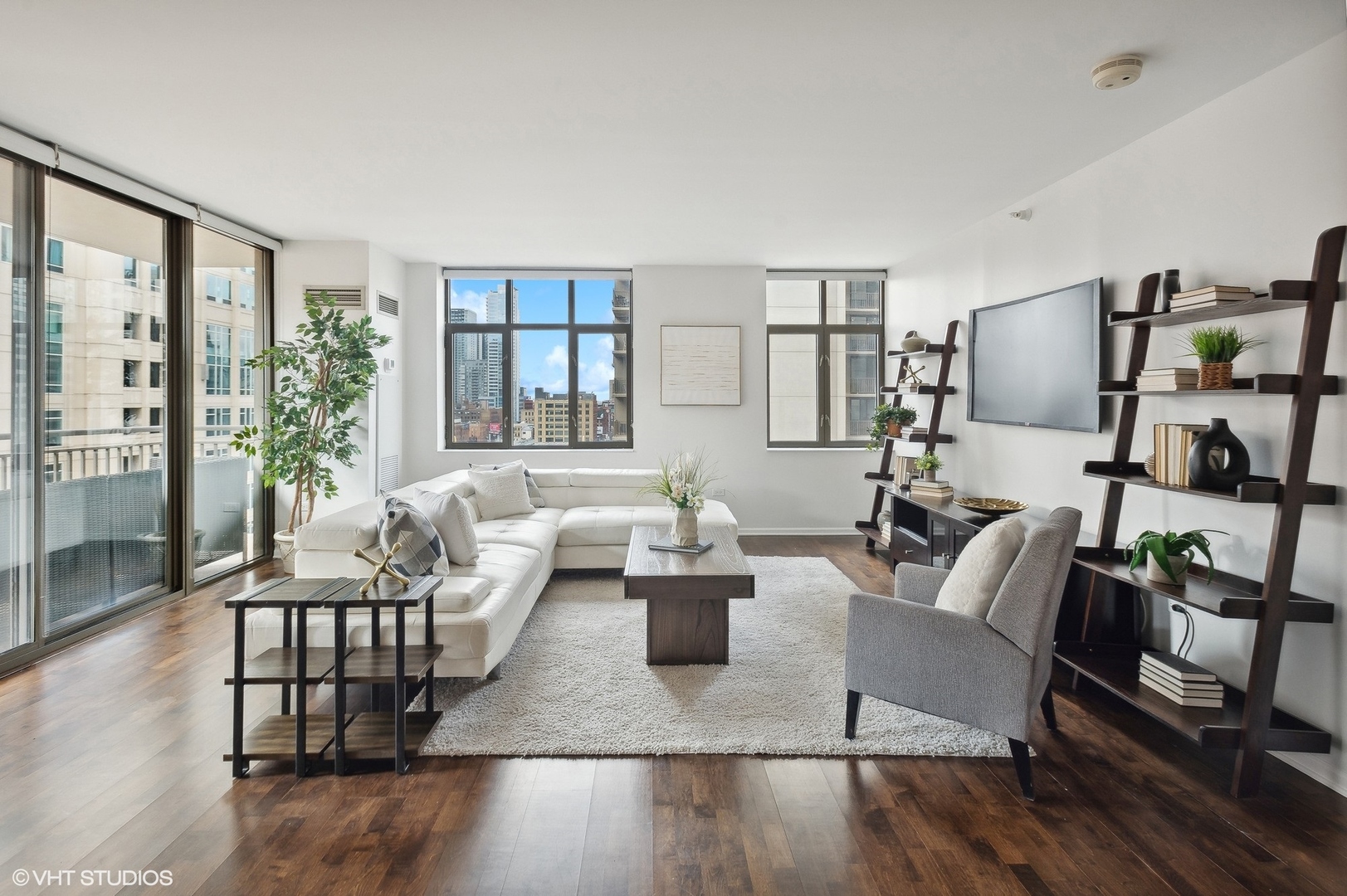 630 North State Street, Unit 1108 Chicago, IL 60654 - Photo 4 of 22 a living room with furniture and floor to ceiling windows