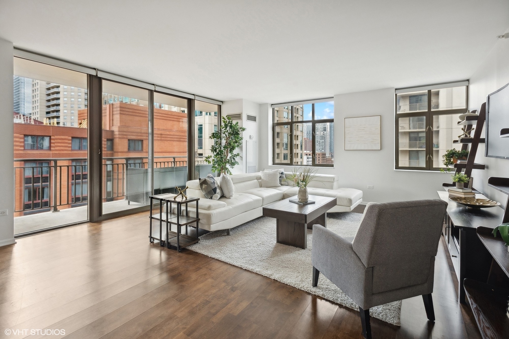 630 North State Street, Unit 1108 Chicago, IL 60654 - Photo 5 of 22 a living room with fireplace furniture and a large window