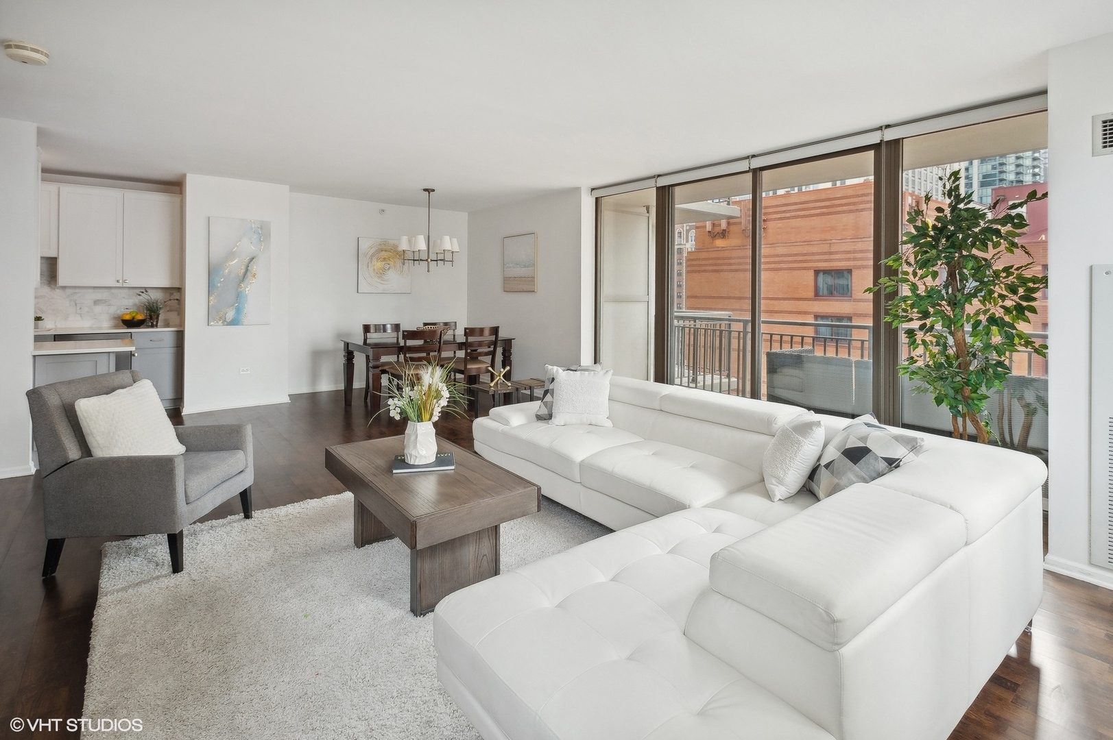 630 North State Street, Unit 1108 Chicago, IL 60654 - Photo 6 of 22 a living room with furniture and a large window