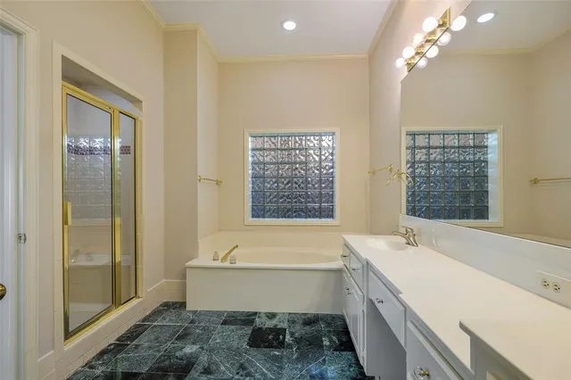 a bathroom with a bathtub and a sink