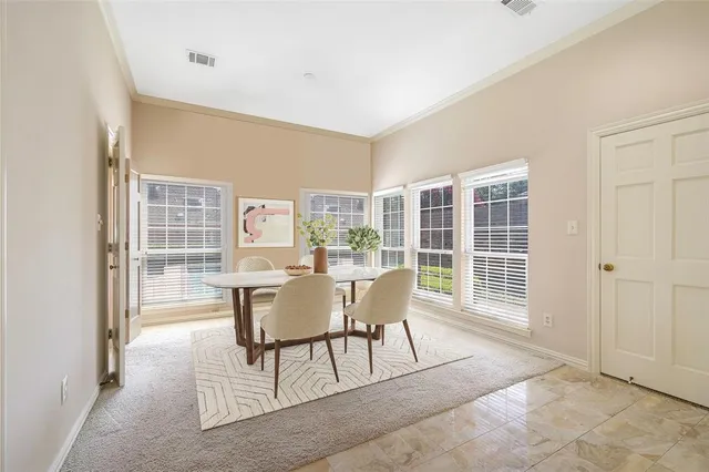a dining room with furniture window and outside view
