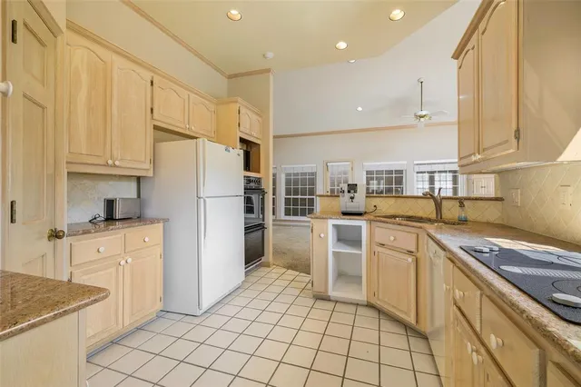 a kitchen with cabinets and appliances