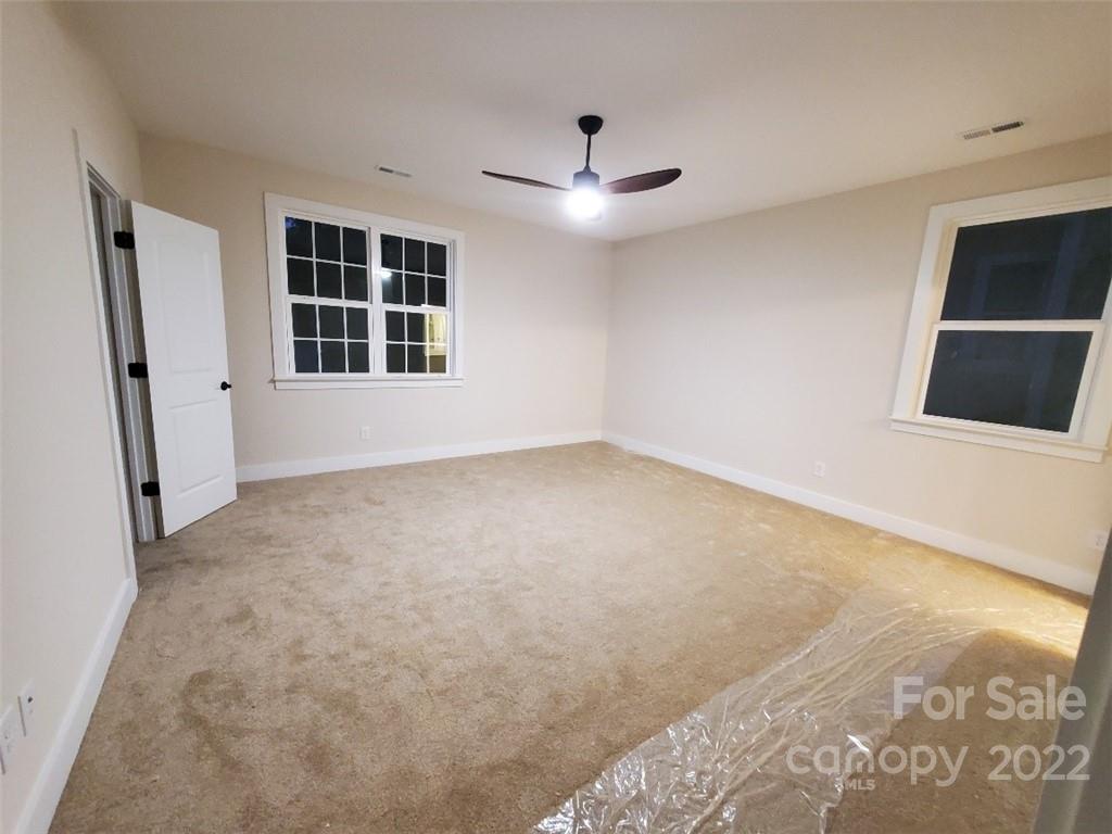 5201 Valley Stream Road Charlotte, NC 28209 - Photo 11 of 17 a view of an empty room with a window