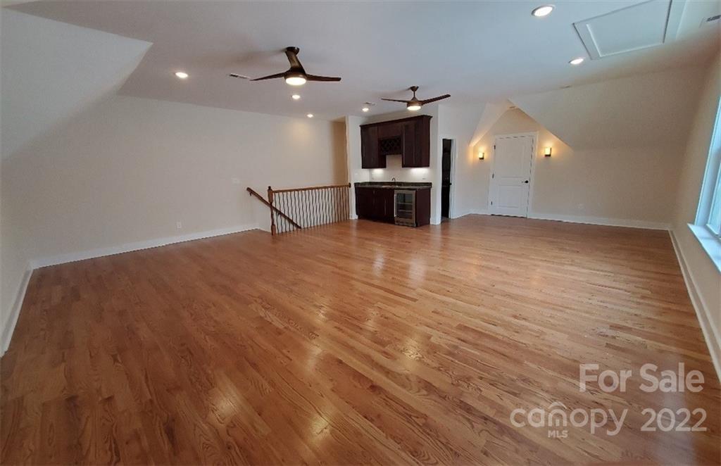 5201 Valley Stream Road Charlotte, NC 28209 - Photo 13 of 17 a view of an empty room with a kitchen
