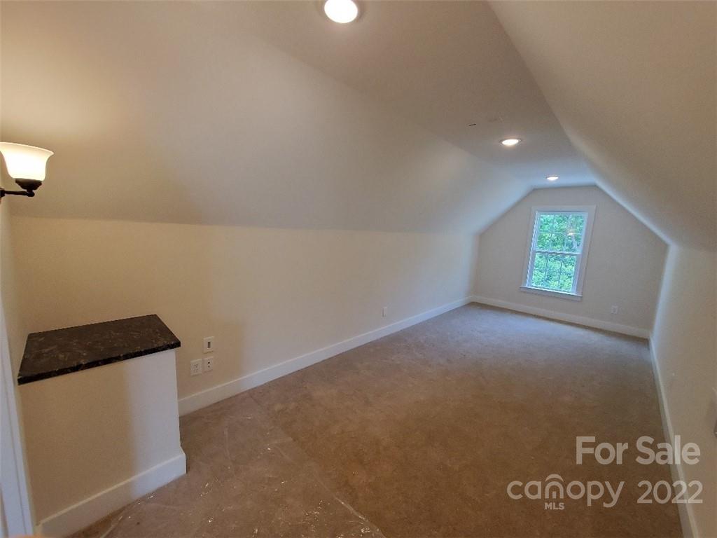 5201 Valley Stream Road Charlotte, NC 28209 - Photo 16 of 17 a view of an empty room with a window