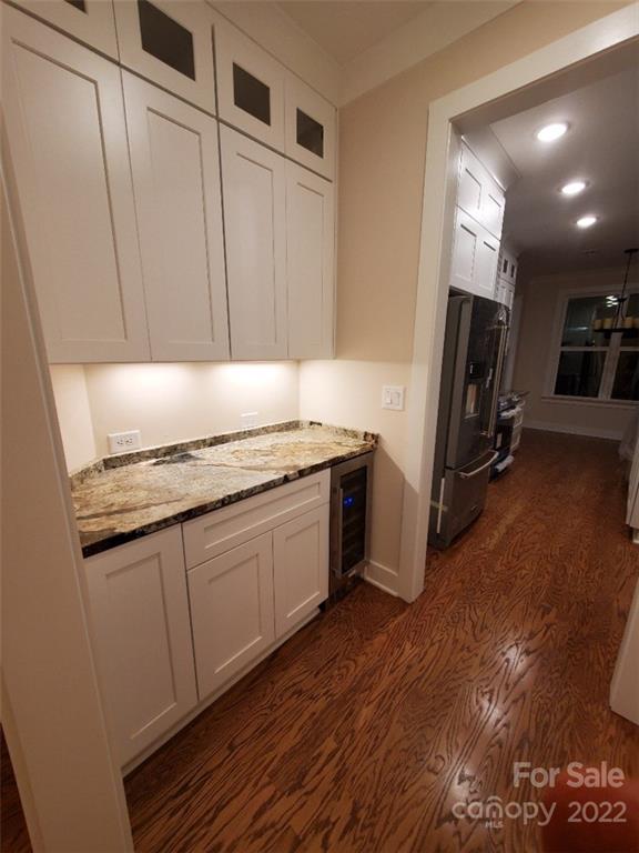 5201 Valley Stream Road Charlotte, NC 28209 - Photo 9 of 17 a kitchen with granite countertop a refrigerator and a sink