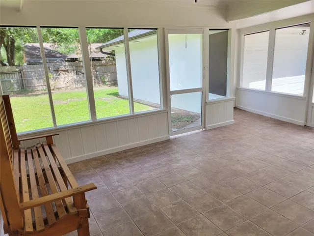 a view of an empty room with windows