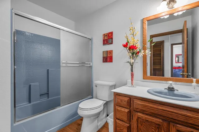 a bedroom with a bed and a dresser