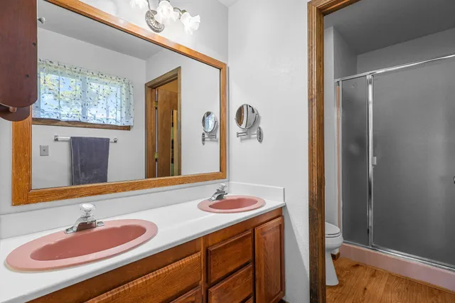 a kitchen with a refrigerator and a stove top oven