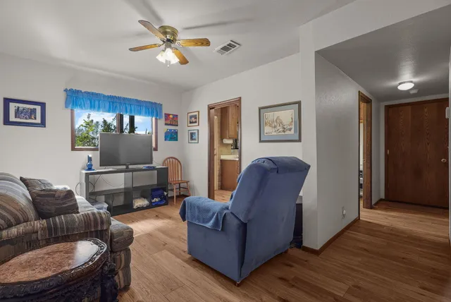 a bathroom with a toilet and a mirror