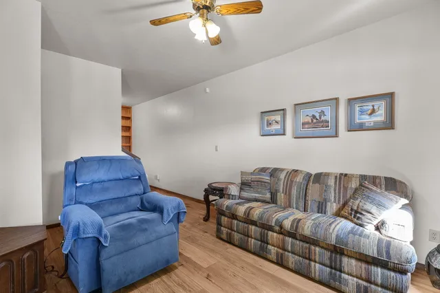 a view of a balcony with furniture and wooden deck