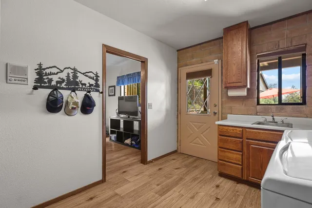 a view of a chairs and table in patio