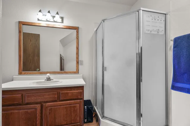 a view of a house with backyard sitting area and garden