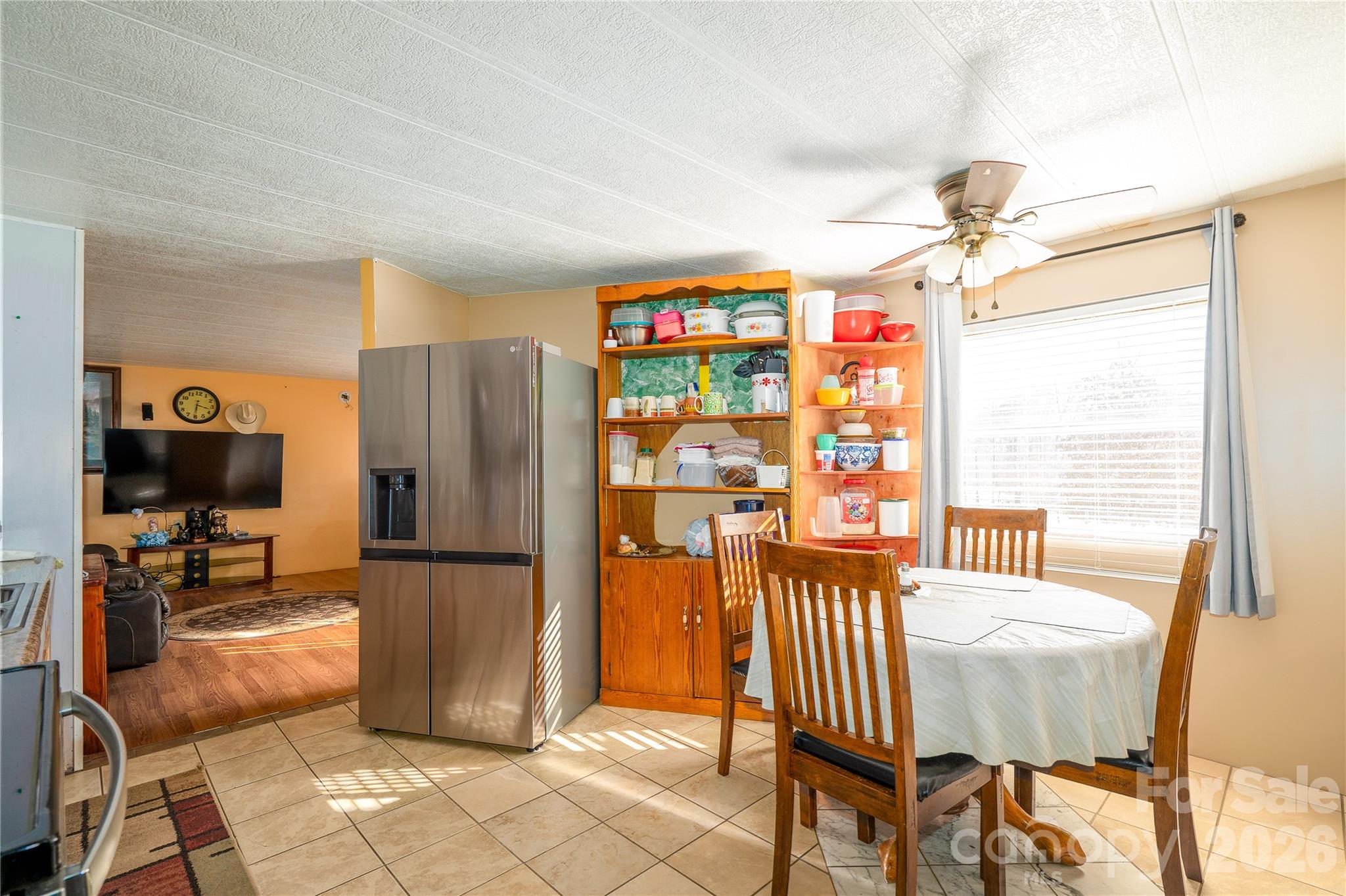 153 Lake Road Rockingham, NC 28379 - Photo 20 of 30 a kitchen with stainless steel appliances granite countertop a refrigerator and a dining table