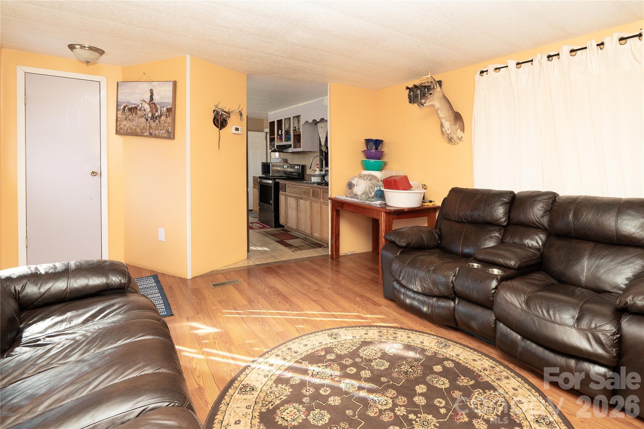 153 Lake Road Rockingham, NC 28379 - Photo 22 of 30 a living room with furniture and a bed