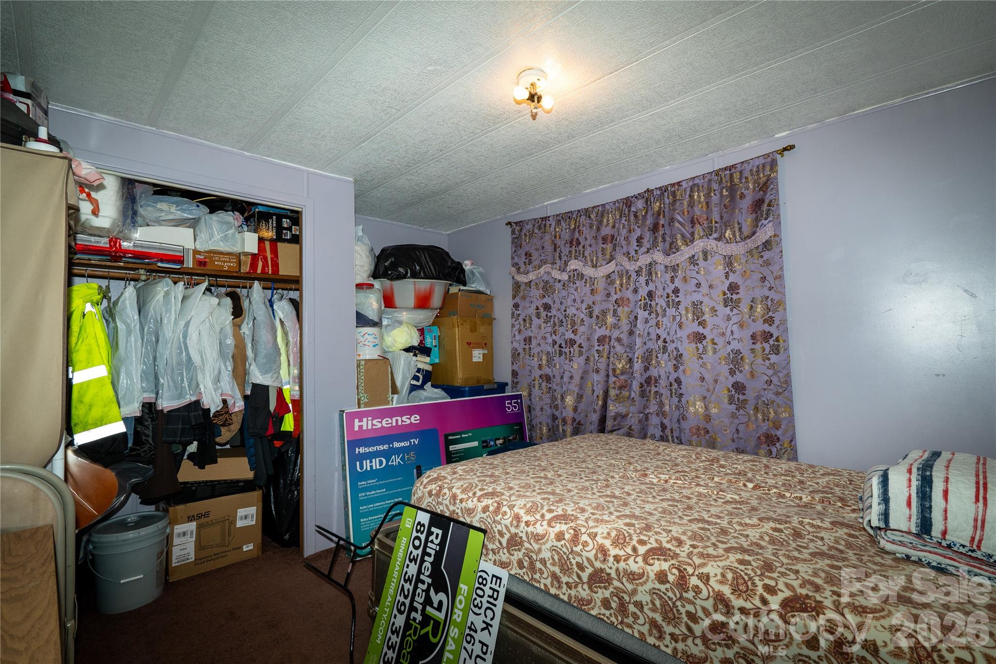 153 Lake Road Rockingham, NC 28379 - Photo 23 of 30 a bedroom with a bed and a dresser in it