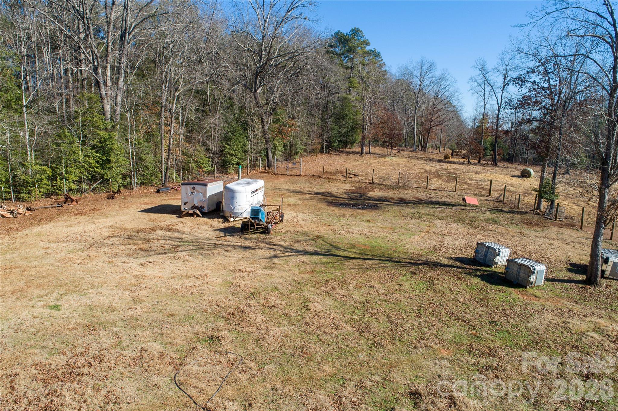 153 Lake Road Rockingham, NC 28379 - Photo 8 of 30 a view of a yard with a car parked