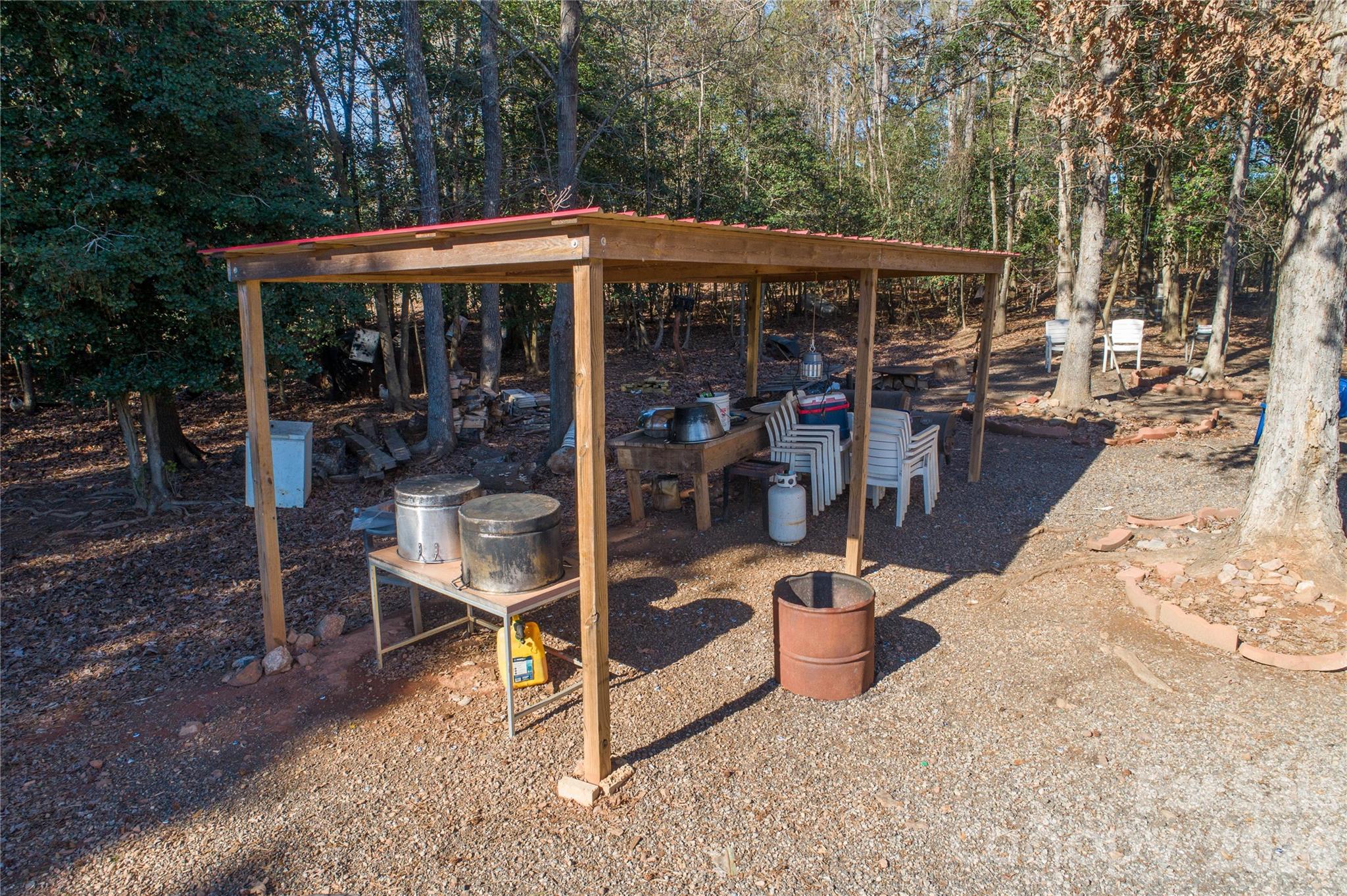 153 Lake Road Rockingham, NC 28379 - Photo 10 of 30 a view of a patio with table and chairs under an umbrella