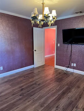 a view of a livingroom with wooden floor