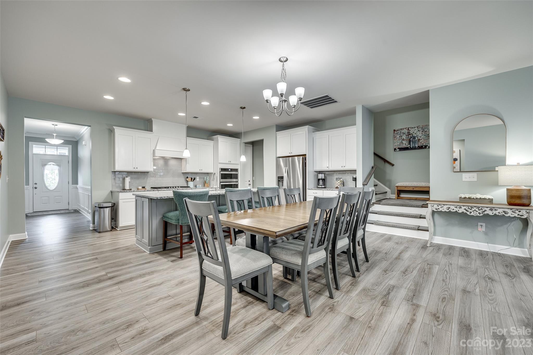 439 Sandbar Point Clover, SC 29710 - Photo 11 of 36 a view of a dining room with furniture and wooden floor