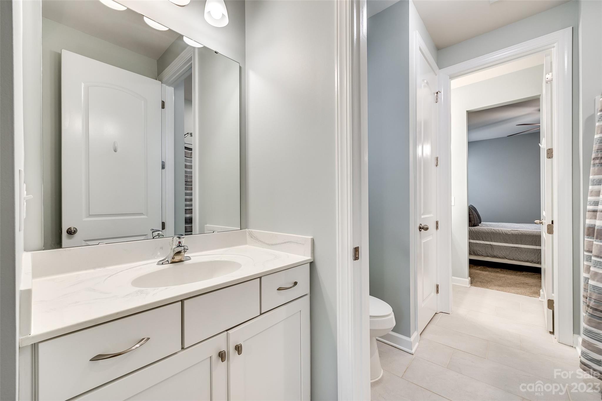 439 Sandbar Point Clover, SC 29710 - Photo 21 of 36 a en suite bathroom with a sink and a mirror