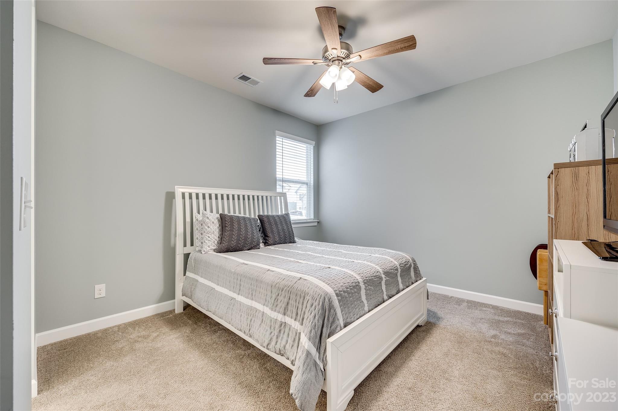 439 Sandbar Point Clover, SC 29710 - Photo 22 of 36 a large bed sitting in a bedroom next to a window