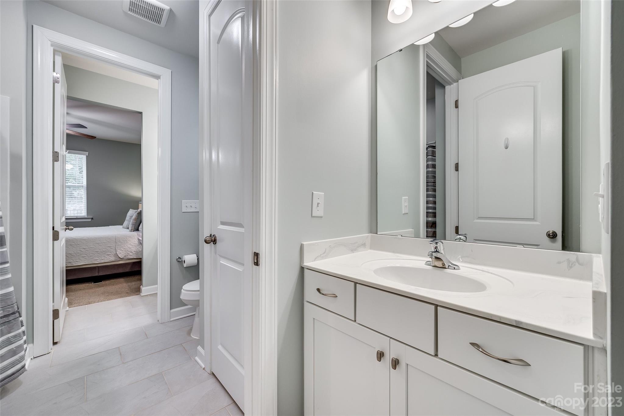 439 Sandbar Point Clover, SC 29710 - Photo 24 of 36 a en suite bathroom with a sink and a mirror