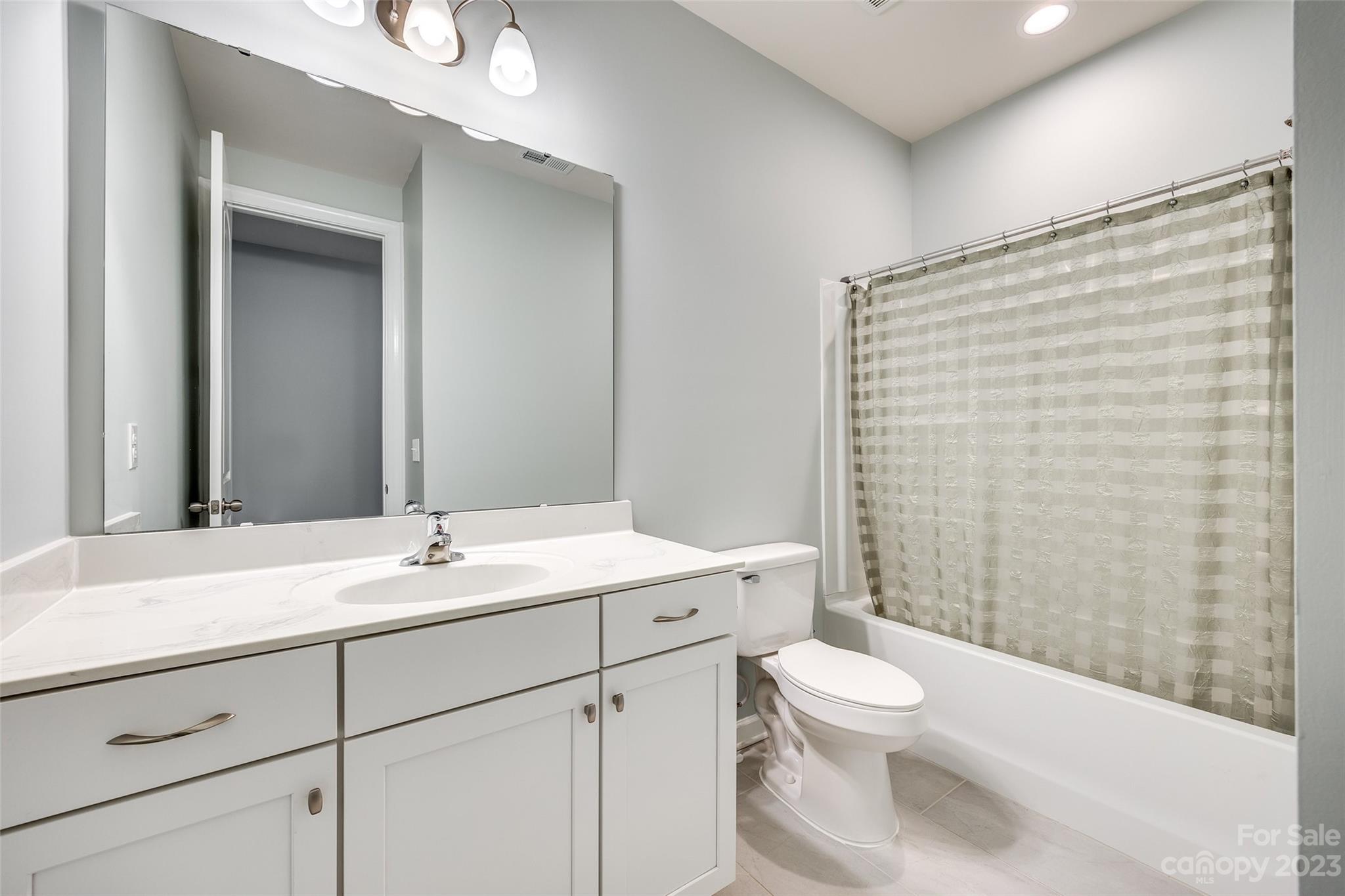 439 Sandbar Point Clover, SC 29710 - Photo 30 of 36 a bathroom with a sink a toilet and shower