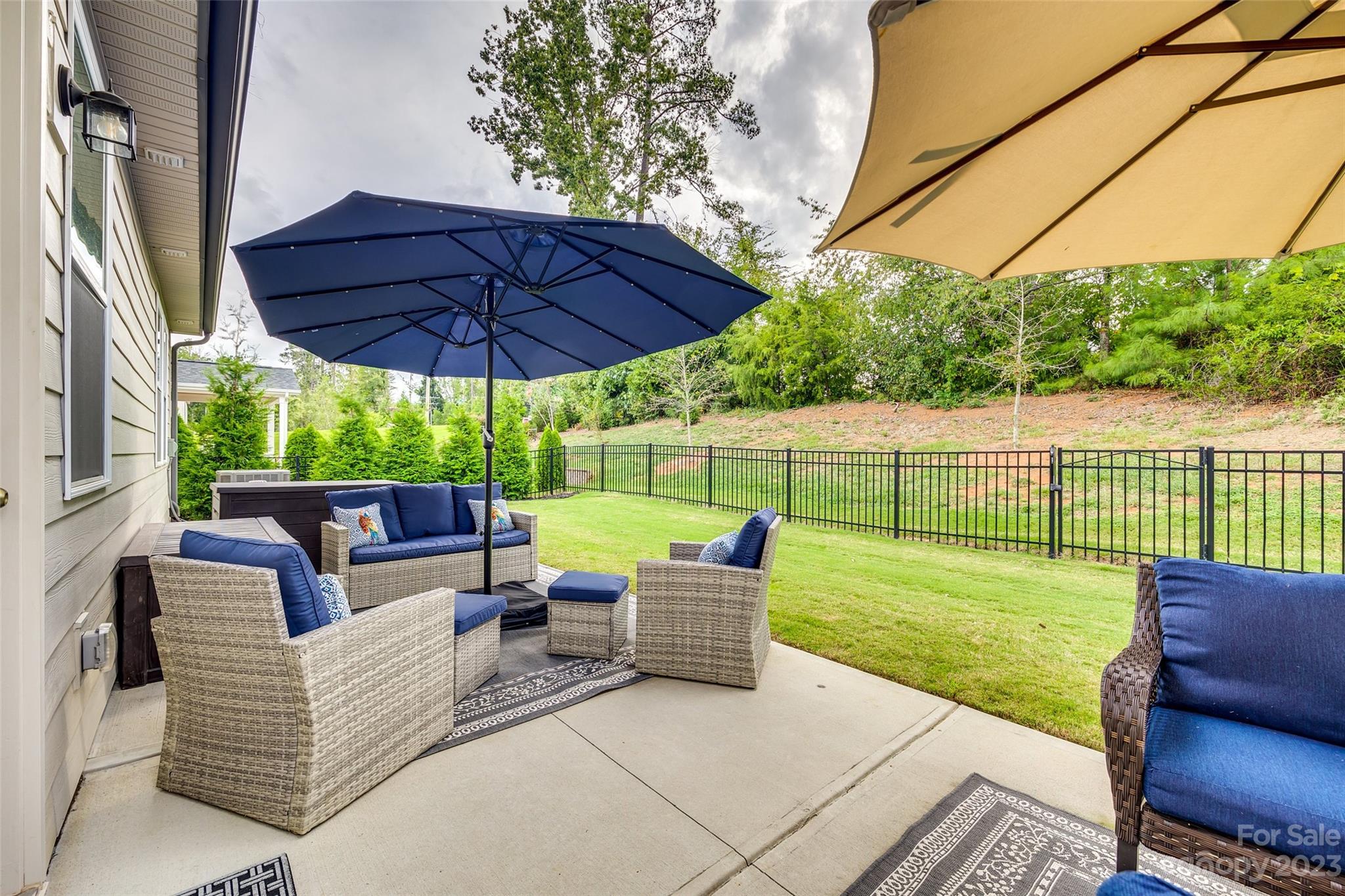 439 Sandbar Point Clover, SC 29710 - Photo 32 of 36 a view of a patio with a table chairs and a yard