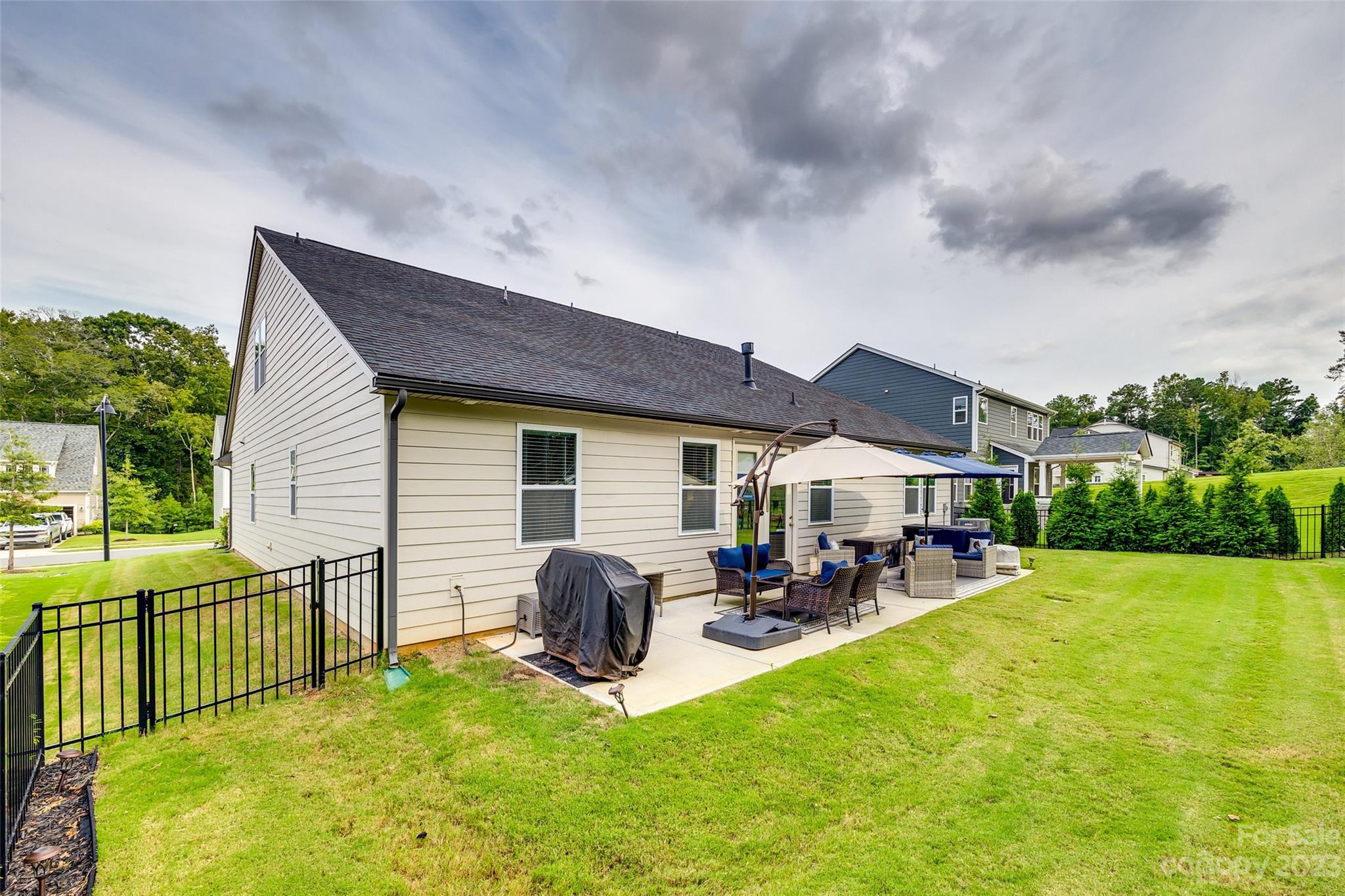 439 Sandbar Point Clover, SC 29710 - Photo 33 of 36 a view of a house with a yard patio and fire pit