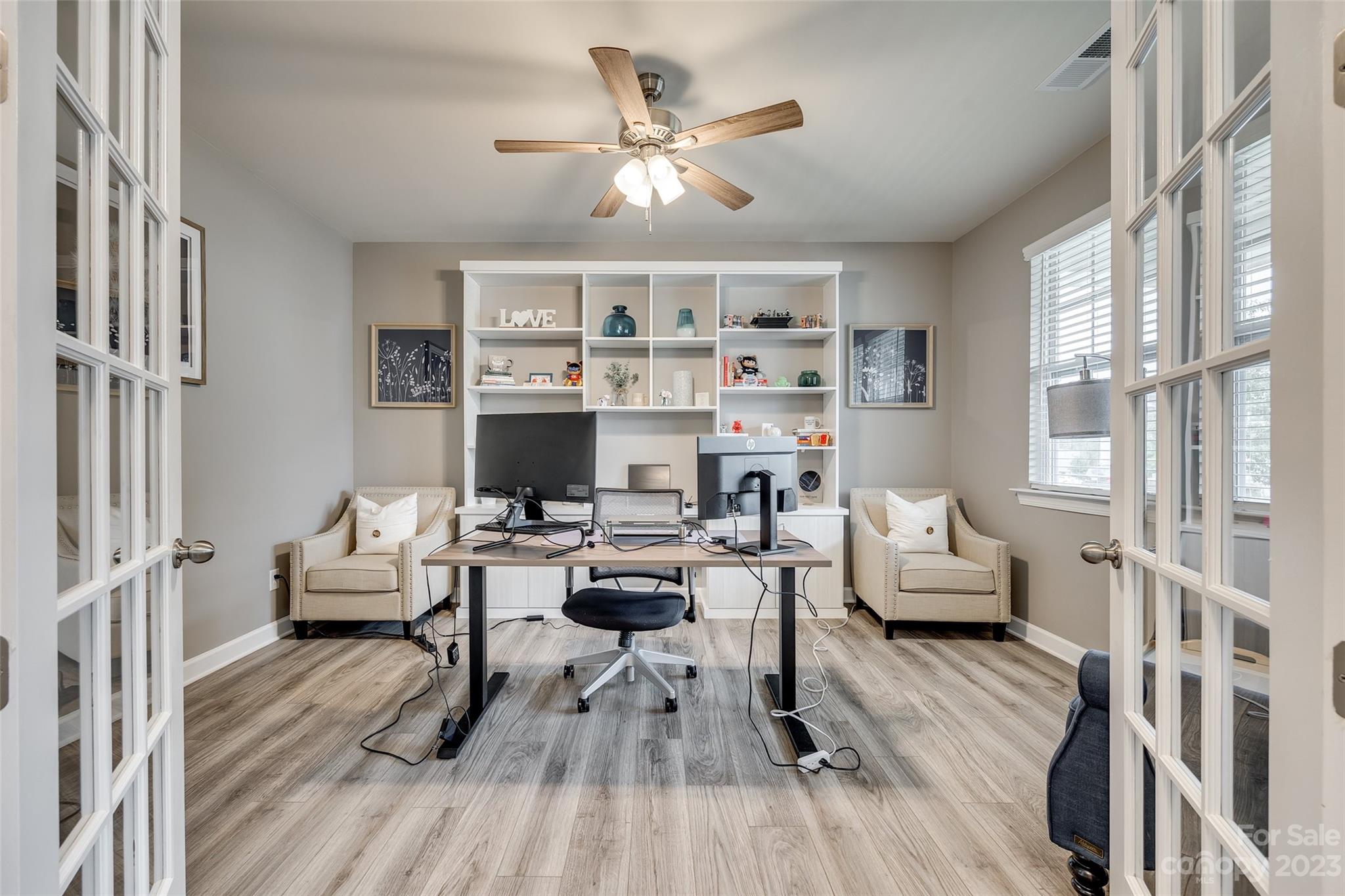 439 Sandbar Point Clover, SC 29710 - Photo 7 of 36 a living room with furniture floor to ceiling window and wooden floor