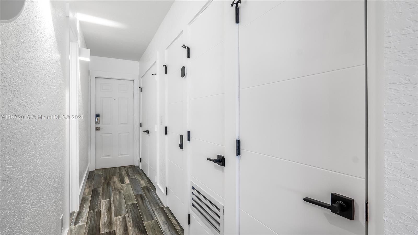 201 Van Buren Street, Unit 103 Hollywood, FL 33019 - Photo 15 of 25 a view of a walk in closet