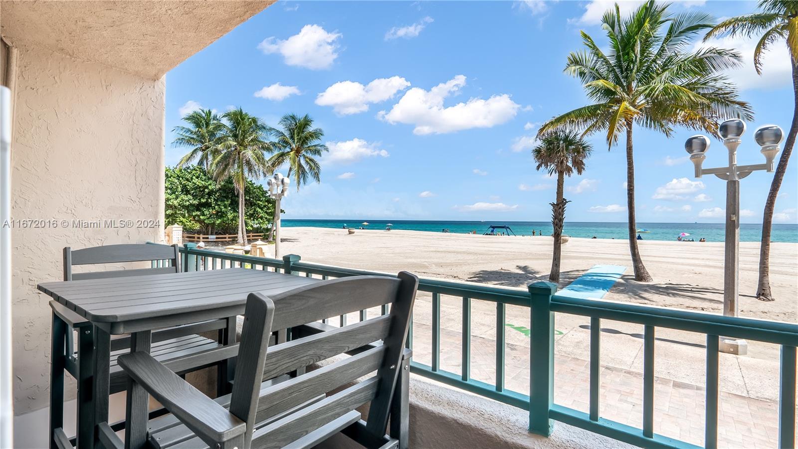 201 Van Buren Street, Unit 103 Hollywood, FL 33019 - Photo 17 of 25 a view of a dining room with furniture and a potted plant