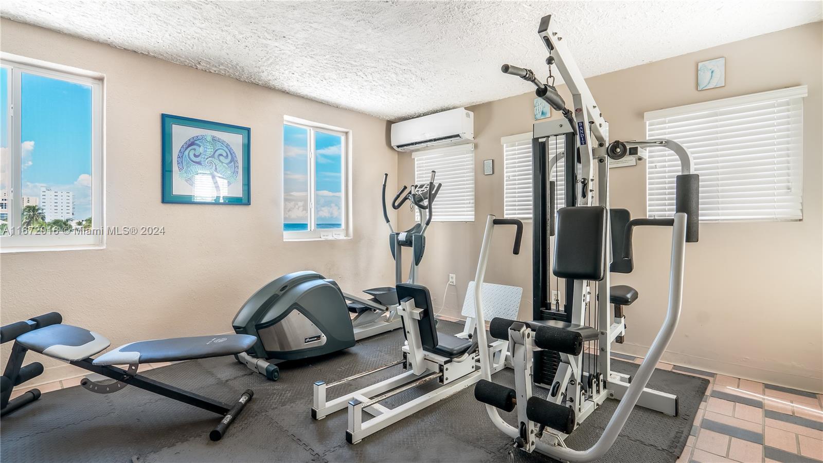 201 Van Buren Street, Unit 103 Hollywood, FL 33019 - Photo 18 of 25 a room with gym equipment