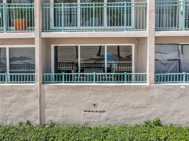 front view of a house with a large window