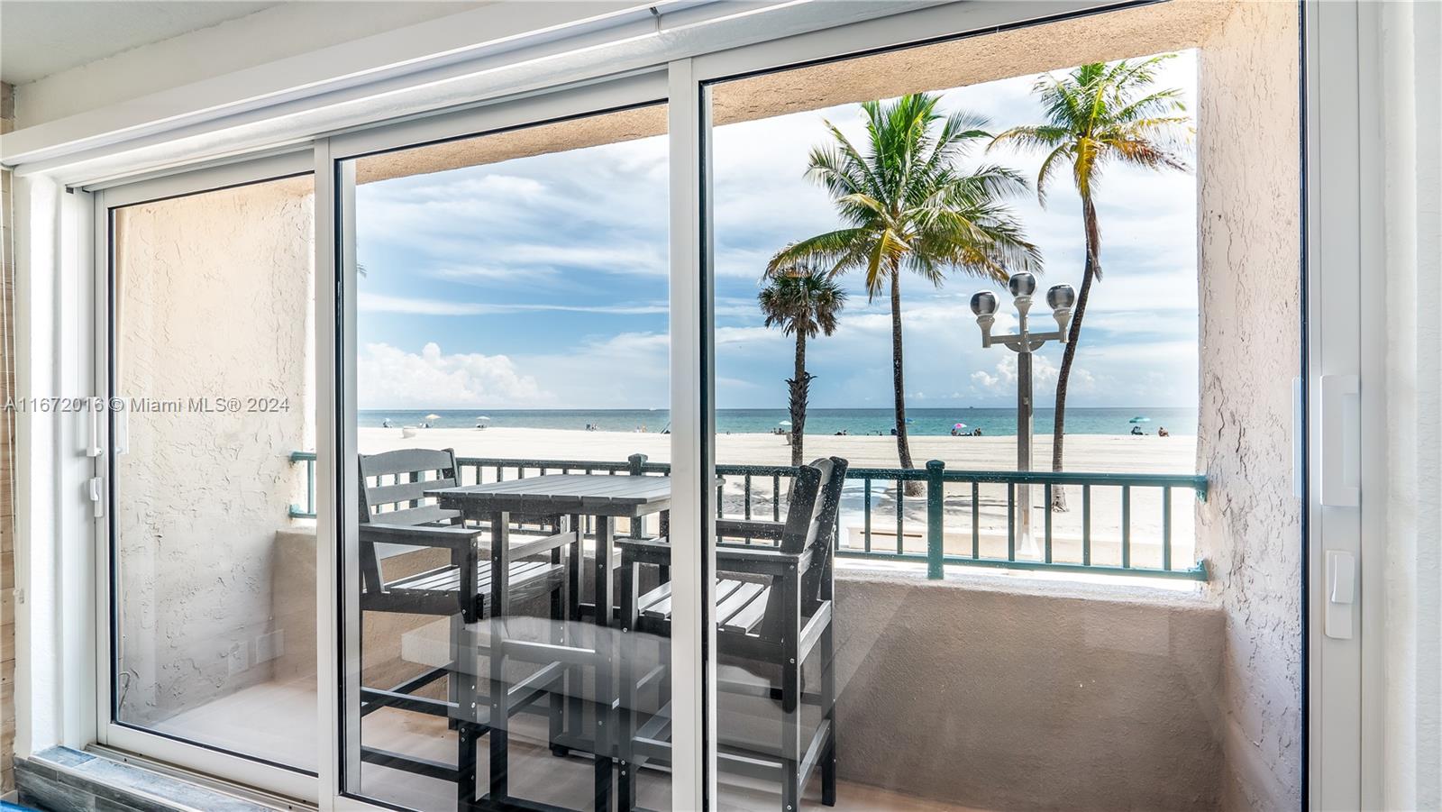 201 Van Buren Street, Unit 103 Hollywood, FL 33019 - Photo 7 of 25 a view of a room with furniture and window