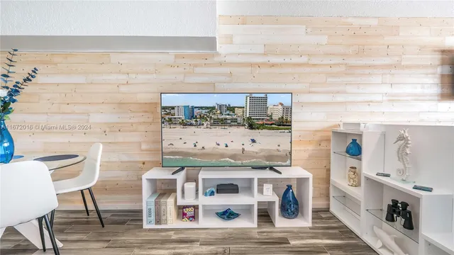 a view of a kitchen with table and chairs