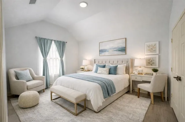 a bedroom with a bed and a couch