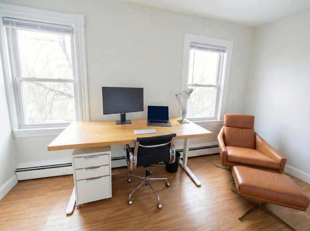 20 Fellsway West, Unit 2 Somerville, MA 02145 - Photo 5 of 16 a workspace with wooden floor and a window