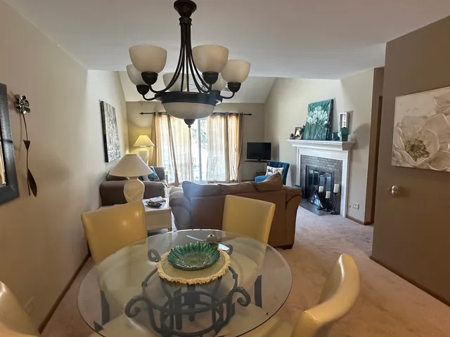 a kitchen with stainless steel appliances granite countertop a refrigerator a stove and a sink