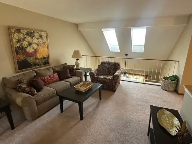 a living room with furniture and a couch