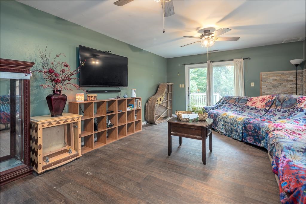 4036 Shelby Road Millington, TN 38053 - Photo 13 of 26 a bedroom with furniture and a flat screen tv