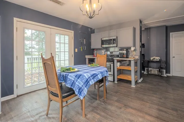 a dining room with furniture and window